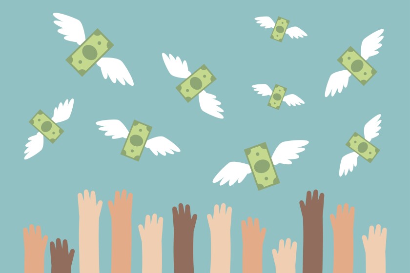 Hands reaching toward money with wings. (Nadia Bormotova, iStock, Getty Images)