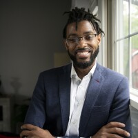 Community Foundation of Greater Flint CEO Isaiah Oliver poses for a portrait at his home in Fenton, Mich. on Thursday, May 19, 2022.