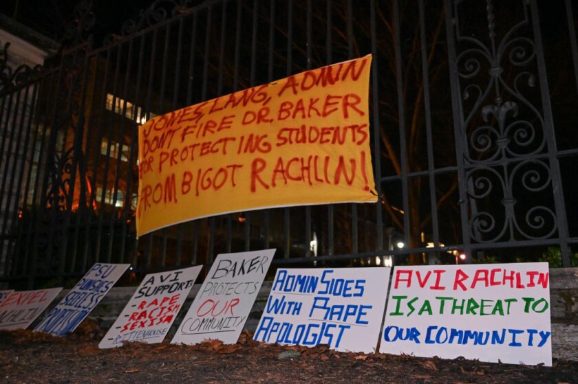 Signs and banners at a January 2022 rally in support of Oliver Baker.