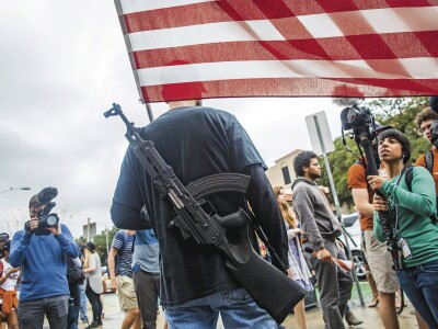 Gun-rights activists march near the campus of the U. of Texas at Austin. As of August 1, it will be legal to carry concealed weapons into classrooms and other buildings there.