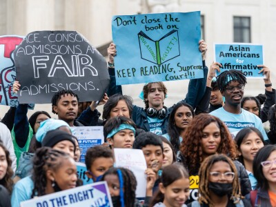 WASHINGTON, D.C. - OCTOBER 31: Supporters pose for a group photo during a rally in support affirmative action policies outside the Supreme Court in Washington, D.C. on October 31, 2022. The Supreme Court is again examining whether universities may consider race when trying to build diverse student bodies, reviewing admissions policies at Harvard University and the University of North Carolina. (Eric Lee, The Washington Post via Getty Images)