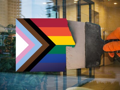 Photo-illustration of a hand scraping a pride flag off a window
