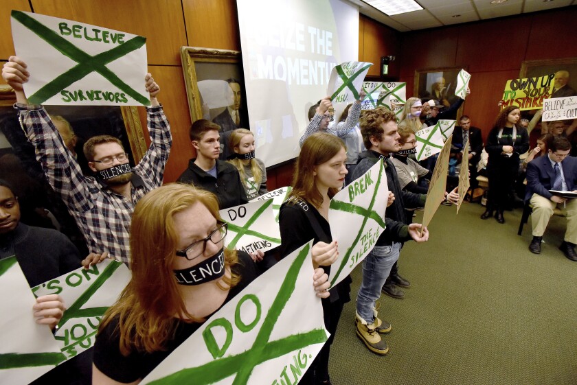 Michigan State U. students protested the university’s handling of the Larry Nassar scandal during a meeting of the Board of Trustees in December. Some students plan to call for the resignation of Lou Anna Simon, the president.