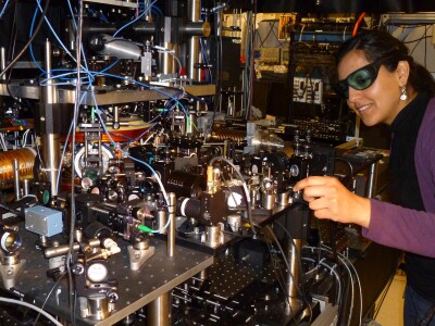 A physics grad student at the U. of Maryland works on an atomic physics experiment studying quantum information, the kind needed to build a superfast computer. That would require sophisticated cooperation between computer scientists, physicists, mathematicians, and engineers, which could be facilitated by the Office of Science and Technology Policy.