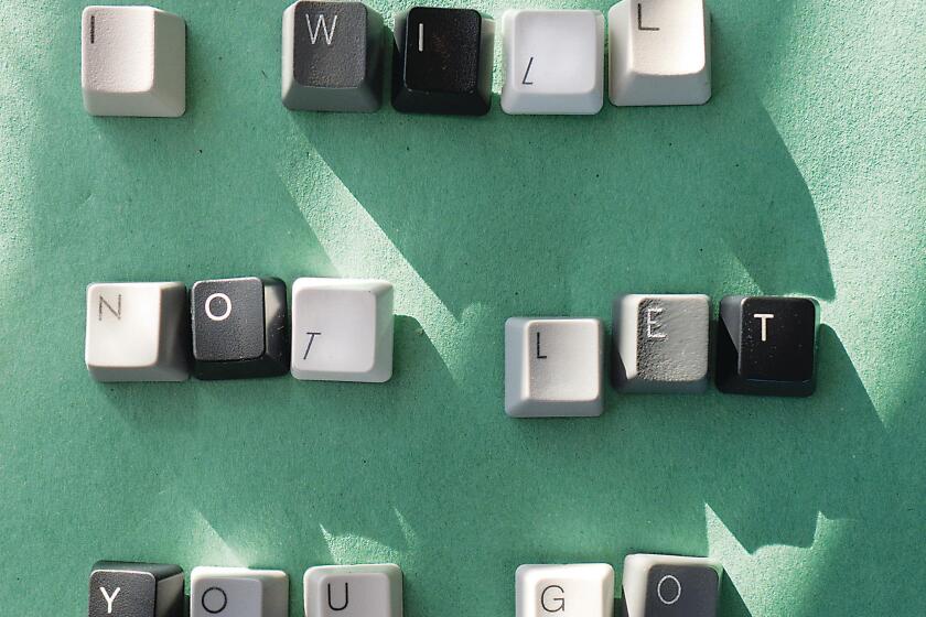 Detached keyboard keys spell out “I WILL NOT LET YOU GO.”