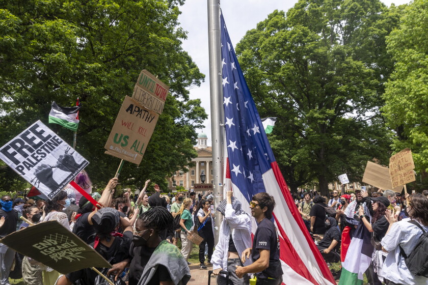 Fraternity Members at UNC Go Viral — and Reap Donations — for Guarding the Flag During Protest Fraternity Members at UNC Go Viral — and Reap Donations — for Guarding the Flag During Protest