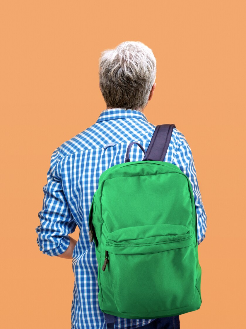 An older non-traditional student and his backpack