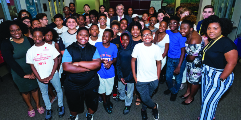 Charles Robbins (center), vice provost and director of SBU’s Freedom School, is flanked by the program’s 2017 graduates.