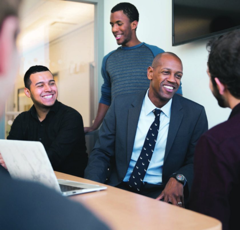 Assistant Professor Thomas Woodson (center) helps community college mathematics transfer students through S-STEM ASSETS.