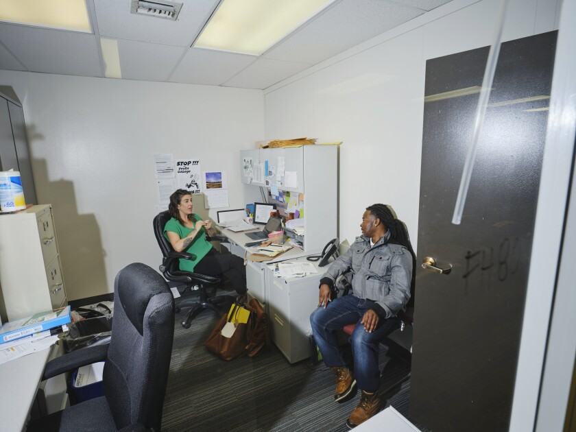 Liz Franczyk and Jermaine House chat in the office of Liz Franczyk, an adjunct professor at MATC, and administrator of the FASTFund e on the MATC Downtown Campus.