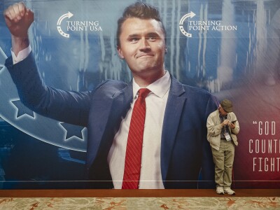 An attendee waits for the start of Turning Point's annual AmericaFest conference, in remembrance of late right-wing political activist Charlie Kirk, in Phoenix, Arizona on December 18, 2025.