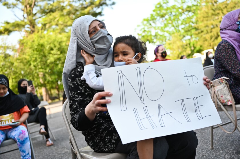 Woman and child join solidarity rally at Long Island mosque in 2021