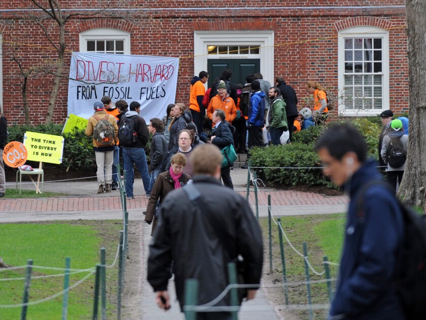 (Boston, MA, 04/30/14) Protestors block the main entrance to Harvard University President Drew Faust?s office, calling for an open meeting with Harvard?s governing body about fossil fuel divestment on Wednesday, April 30, 2014. Staff photo by Christo